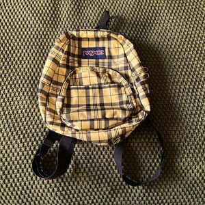 Jansport, yellow flannel design mini backpack.
